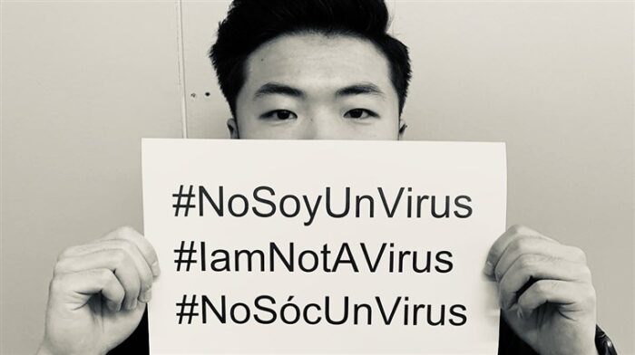 asian holding placard sign